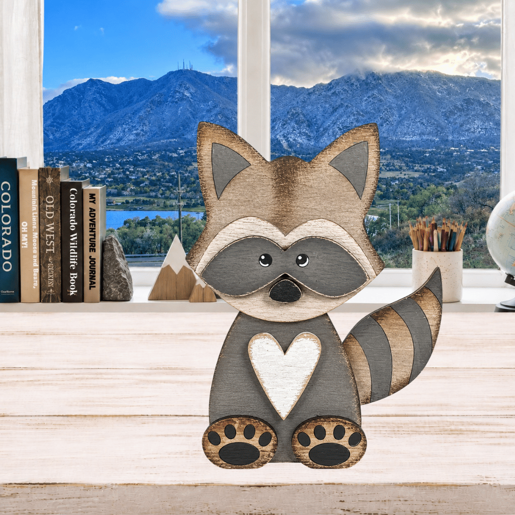 Layered Raccoon Shelf Sitter